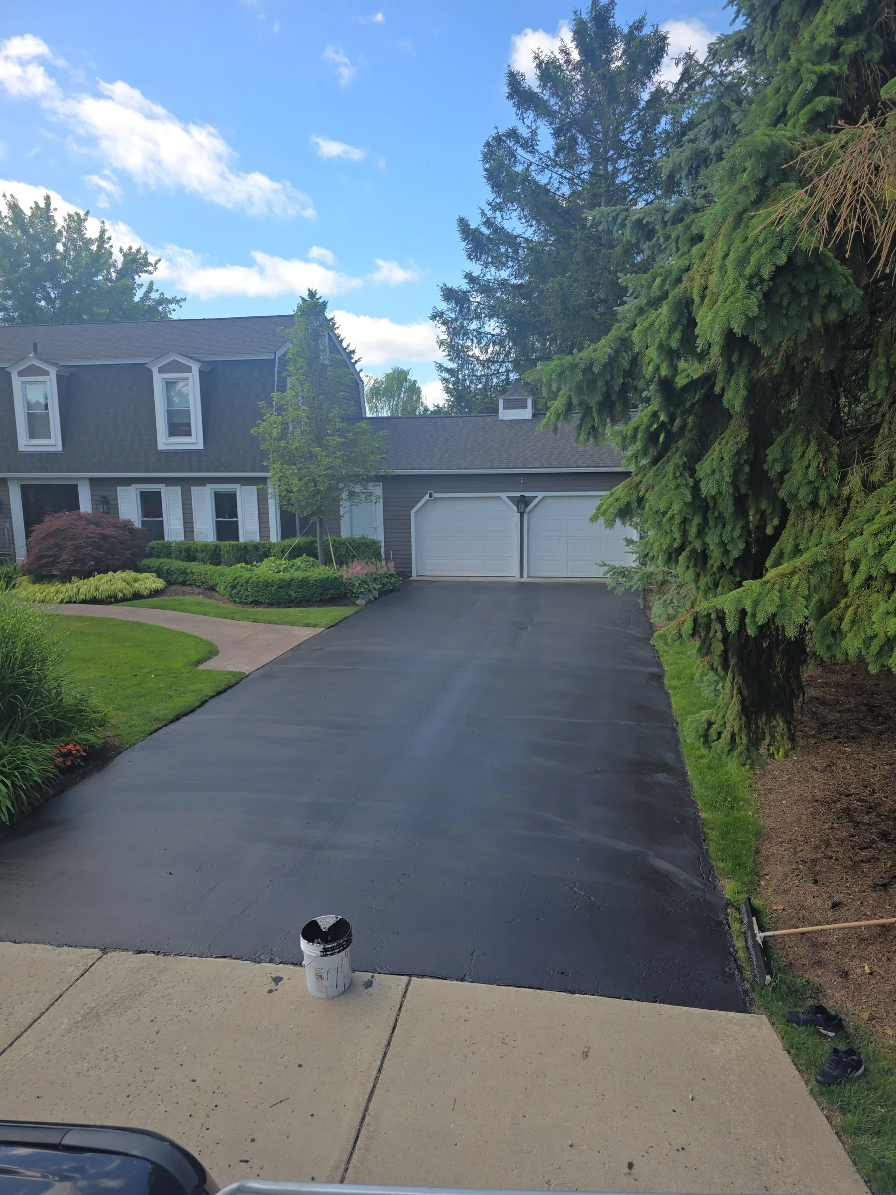 Driveway sealcoating
